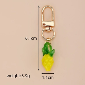 Miniature glass pineapple keychain with dimensions 6.1cm by 1.1cm and 5.9g weight