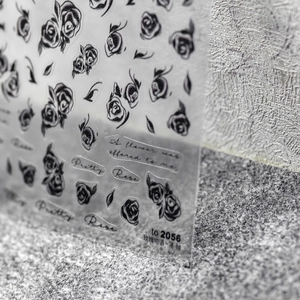 Macro shot of ultra-thin black rose nail art stickers with model number TO-2056