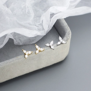 Detail of s925 silver stud earrings with gold and silver water drop cubic zirconia gems