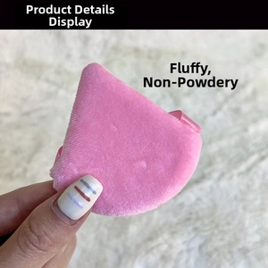 Detail view of pink teardrop velvet puff with a secure ribbon for precise face makeup