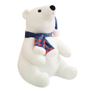 Cute Christmas polar bear plush toy with blue heart scarf and hat on white background
