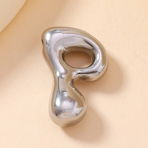 Macro shot of silver metal letter P bubble pendant with smooth liquid texture