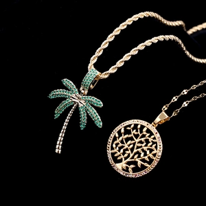 Gold plated hip hop necklaces featuring coconut tree and life tree pendants with CZ stones