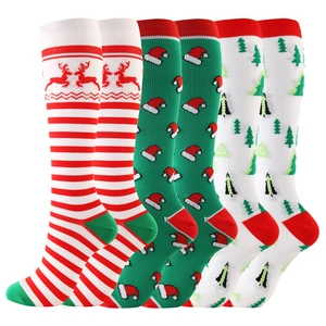 Three-pack festive Christmas compression socks with elk, Santa, and tree patterns