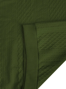 Detail of olive green knit hoodie with textured diamond jacquard and ribbed cuff edges