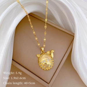 Detail of gold lucky cat pendant with sparkling rhinestones and product size info
