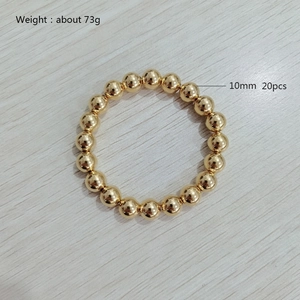 Elastic beaded bracelet with 10mm golden stainless steel beads and 73g weight detail