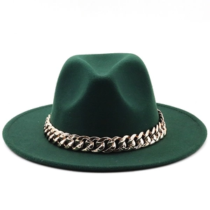 Detail of dark green wool fedora hat featuring a chunky gold metal chain decoration