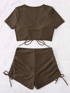 Close-up of brown two-piece bikini featuring stylish side drawstrings and ribbed texture