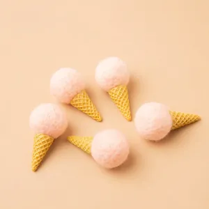 Pink wool felt ice cream ornaments with yellow waffle cones for Christmas tree DIY decor