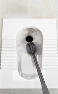 Close-up of extendable gray toilet brush with long handle for deep bathroom cleaning