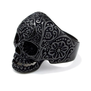 Matte black stainless steel skull ring with Mexican sugar skull carvings and floral patterns