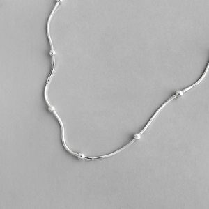 Elegant S925 sterling silver snake chain necklace featuring polished minimalist beads