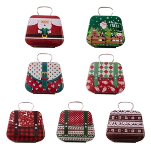 Set of Christmas tinplate candy gift boxes with metal handles and festive patterns
