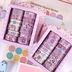 Detail of floral washi tape set in purple shades with gold foil accents and botanic patterns