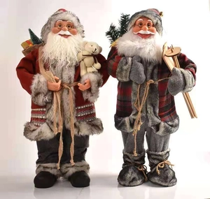 Detail of 45cm Santa Claus figurines with red and grey plaid fabric and faux fur texture