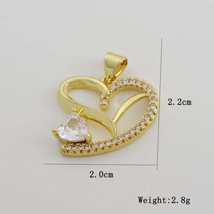 Detailed view of 18K gold heart pendant dimensions 2.2cm height with zircon inlay