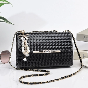 Chic black woven faux leather handbag with golden chain strap and pearl charm