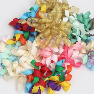 Detailed view of colorful curly grosgrain and metallic ribbons for DIY gift wrapping