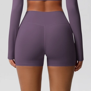 Rear view of high-waisted deep purple yoga shorts and cropped top with lifting seams