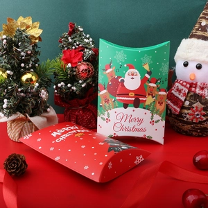 Christmas pillow gift boxes in red and green with festive Santa and tree patterns