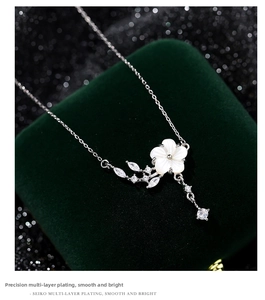 Detail view of s925 silver peach blossom necklace with mother-of-pearl and shiny zircon