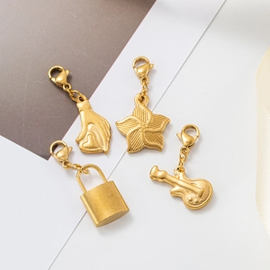 Set of four gold stainless steel pendants featuring heart, flower, lock, and guitar shapes