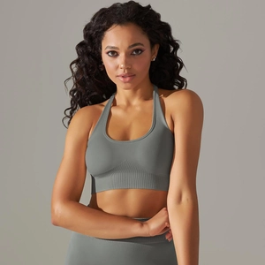Detailed texture of seamless grey knitted sports bra with wide ribbed compression band