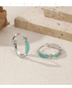 Macro shot of S925 sterling silver stamp on mint green enamel geometric earrings