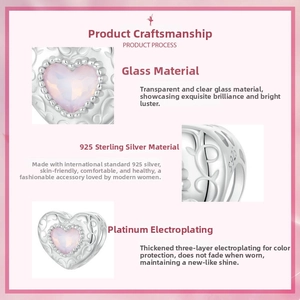 Detail view of heart-shaped S925 sterling silver bead with pink glass and engravings