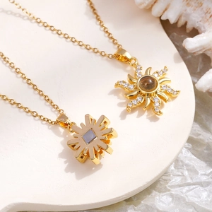 Golden sun and snowflake projection necklace with zircon stone on elegant white stone