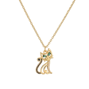 Golden cat necklace with green gemstone eyes and sparkling zircon pendant on white background