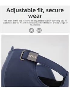 Macro detail of navy cotton baseball cap showing adjustable metal buckle strap at the back