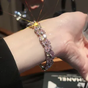 Detailed view of women's silver bracelet featuring marquise-cut pink cubic zirconia stones