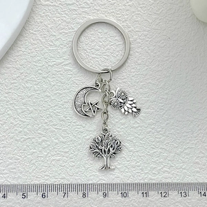 Antique silver tree of life and moon owl keychain with size measurement on white background