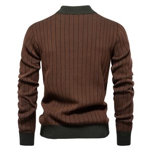 Detailed back view of striped brown knit sweater with dark green contrast trim cuffs