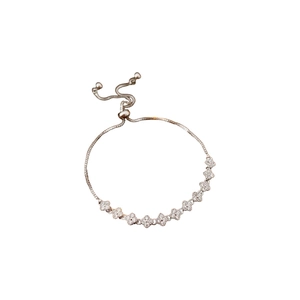 Adjustable rose gold clover bracelet with sparkling cubic zirconia floral charms for women