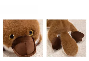 Close-up of plush platypus toy featuring brown faux fur and sparkling golden eyes