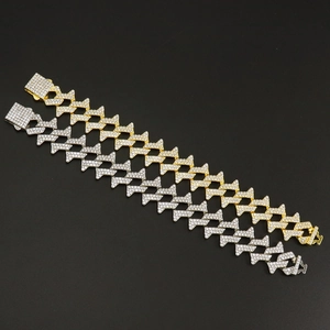 Iced out thorn cuban link bracelet in gold and silver finish with crystal pavé details