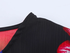 Detailed close-up of a floral chiffon blouse neckline with clean stitching and red flowers