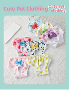 Detail view of assorted printed cotton dog physiological pants with bows and tail holes