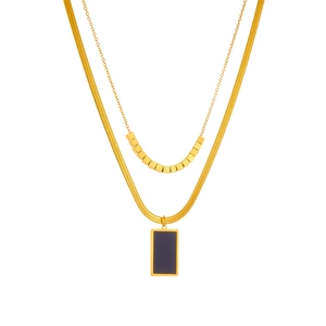 Double-layered gold stainless steel necklace with square accents and a black pendant