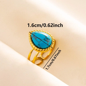 Detail of gold vintage ring featuring teardrop blue stone with 1.6cm dimensions