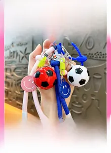 Close-up of a creative football keychain with woven rope and a smiley face pendant