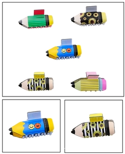Close-up of pencil-shaped hair claws with colorful stripes, sunflowers and smiles