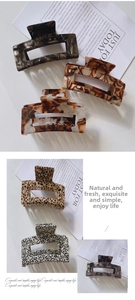 Detail showing various acetate hair claws in amber, leopard, and polka dot patterns