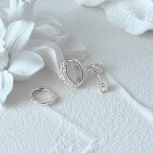 Detail of S925 sterling silver evil eye earring set featuring clear cubic zirconia stones