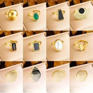 Collection of 12 adjustable gold-plated stainless steel rings with pearls and gems