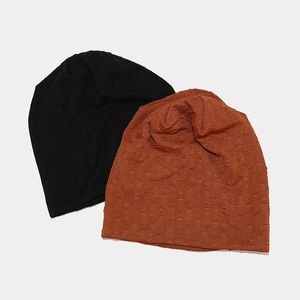 Textured knit slouchy beanies in black and caramel colors for autumn street fashion