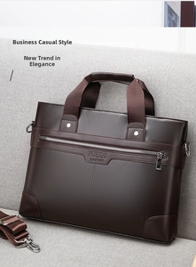 Detail view of dark brown pebbled leather briefcase featuring logo and sturdy handles